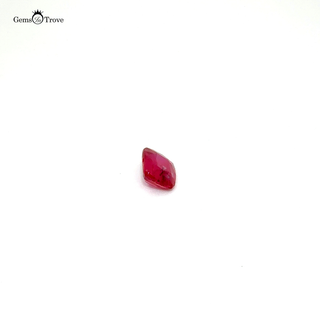A rare untreated ruby in a rectangular cut, captured in high-resolution against a white background.